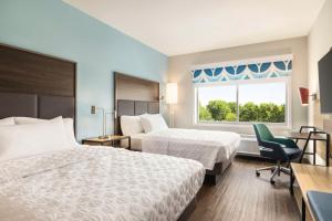 En eller flere senge i et værelse på Tru By Hilton Martinsburg