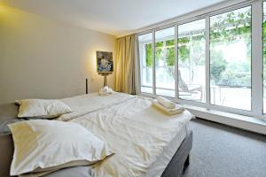 Katil atau katil-katil dalam bilik di ViDa Prostorný 220 m2 3BR Apartmán s Krbem a Zahradou, Ideální pro Rodiny