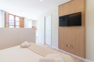 Posteľ alebo postele v izbe v ubytovaní Santa Brigida Window Suite