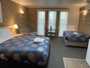 Postel nebo postele na pokoji v ubytování Tropicana Motor Inn + 37 fotografií