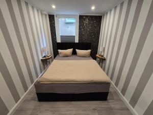 Postel nebo postele na pokoji v ubytování Havel Suites