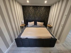 Postel nebo postele na pokoji v ubytování Havel Suites