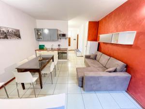 a living room with a couch and a table at In castello 1984 in Rovato