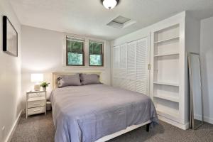 a bedroom with a bed and two windows at The Mendon Cottage - Charming Vermont Home Close to Pico, Ski Rental Deals! in Mendon