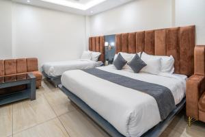 Hotel The Vaishvik客房内的一张或多张床位