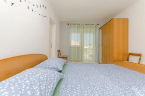 Postel nebo postele na pokoji v ubytování Apartments Danica