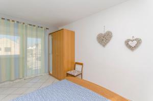 Postel nebo postele na pokoji v ubytování Apartments Danica