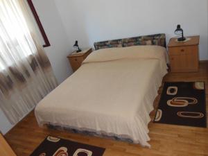 Ένα ή περισσότερα κρεβάτια σε δωμάτιο στο Apartment Jakica