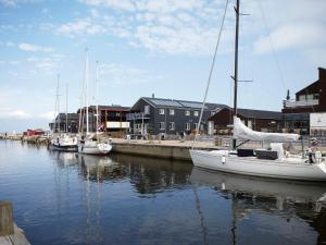 a group of boats docked at a dock in the water at 5 person holiday home on a holiday park in Bogense in Bogense