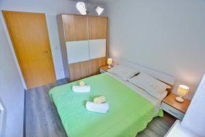 Postel nebo postele na pokoji v ubytování Apartment Lenka Mato