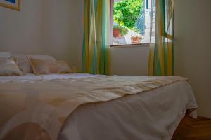 Postel nebo postele na pokoji v ubytování Apartments Daira