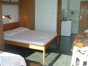Posteľ alebo postele v izbe v ubytovaní Apartments Tonka
