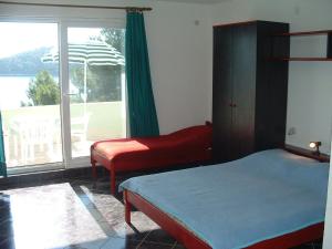 Posteľ alebo postele v izbe v ubytovaní Apartments Tonka