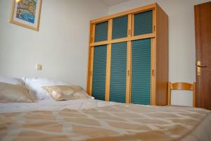 Postel nebo postele na pokoji v ubytování Apartments Daira