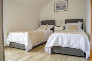 Postel nebo postele na pokoji v ubytování Apartments Daira