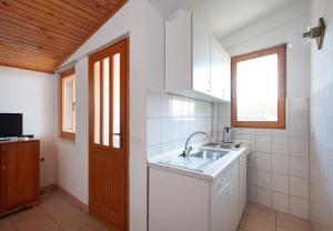 Kuchyňa alebo kuchynka v ubytovaní Apartment Ante M + 37 fotografií