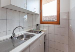 Kuchyň nebo kuchyňský kout v ubytování Apartment Ante M