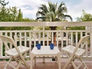 two chairs and a table on a porch at Apartment Toma in Omiš