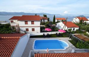 an image of a swimming pool on the roof of a house at Apartment Mihovilovic in Slatine