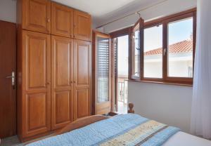 Postel nebo postele na pokoji v ubytování Apartment Ante M