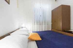 Postel nebo postele na pokoji v ubytování Apartments Vinko
