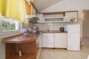 Kuchyň nebo kuchyňský kout v ubytování Apartments Vinko