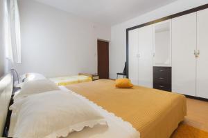 Postel nebo postele na pokoji v ubytování Apartments Vinko