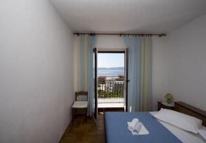Postel nebo postele na pokoji v ubytování Apartments Robert
