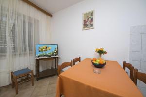 Televízia a/alebo spoločenská miestnosť v ubytovaní Apartment Panorama
