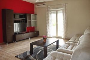 a living room with a couch and a table at Apartment Dita in Nin