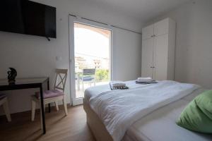 Postel nebo postele na pokoji v ubytování Apartments Mir
