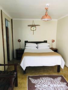 Postel nebo postele na pokoji v ubytování Island Vibe Knysna