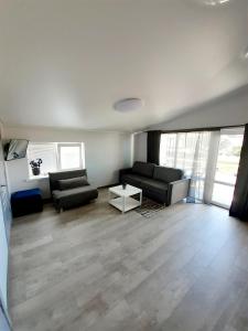 Posezení v ubytování Vyturiai - naujų apartamentų nuoma Šventojoje