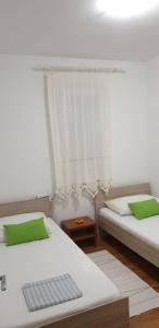 Posteľ alebo postele v izbe v ubytovaní Apartment Natad