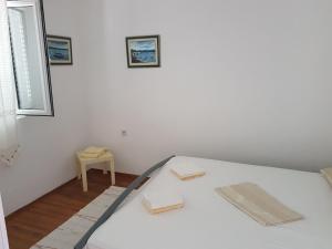 Posteľ alebo postele v izbe v ubytovaní Apartment Natad