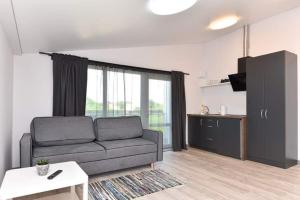 Posezení v ubytování Vyturiai - naujų apartamentų nuoma Šventojoje