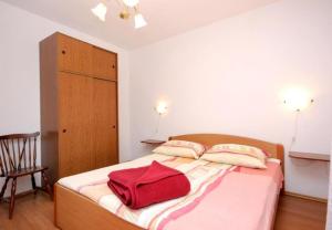 Postel nebo postele na pokoji v ubytování Apartments Roki
