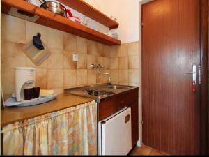 Kuchyňa alebo kuchynka v ubytovaní Apartments Emily + 37 fotografií