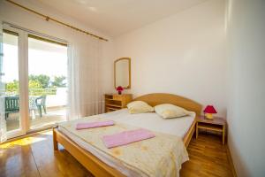 Posteľ alebo postele v izbe v ubytovaní Apartments Saga
