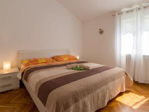 Posteľ alebo postele v izbe v ubytovaní Apartments Petar