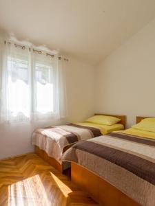 Posteľ alebo postele v izbe v ubytovaní Apartments Petar