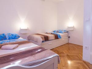 Posteľ alebo postele v izbe v ubytovaní Apartments Petar
