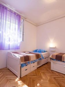 Posteľ alebo postele v izbe v ubytovaní Apartments Petar