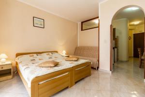 Postel nebo postele na pokoji v ubytování Apartments Mir