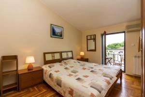 Postel nebo postele na pokoji v ubytování Apartments Mir