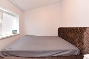 Postel nebo postele na pokoji v ubytování Vyturiai - naujų apartamentų nuoma Šventojoje