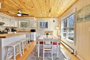 a kitchen and dining room with a table and chairs at Powder Park Place- Upper Unit of Duplex - Great for Groups, Ski Rental Ticket Deals! in Killington