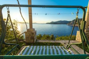 a swing with a view of the water at Apartments Diana in Dubrovnik