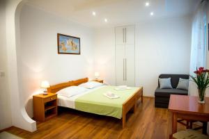 Posteľ alebo postele v izbe v ubytovaní Apartments and Rooms Robi