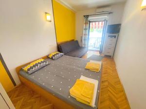 Posteľ alebo postele v izbe v ubytovaní Apartments Ani